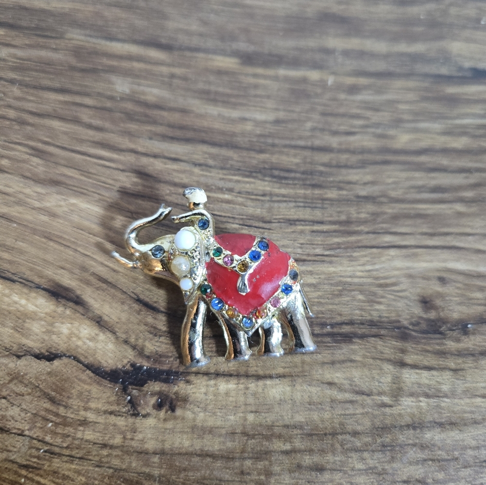 gold-tone elephant pin with rhinestone